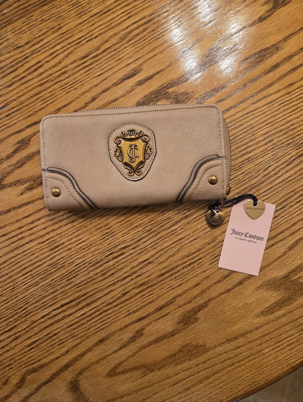 Juicy Couture Beige Zip-Around Wallet with Gold Crest Emblem